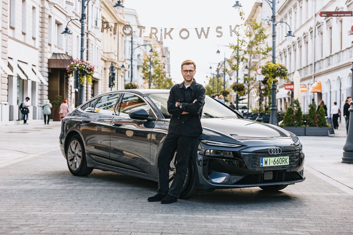 Miko Marczyk next to the Audi A6 Sportback e-tron performance he used to set the Guinness World Record