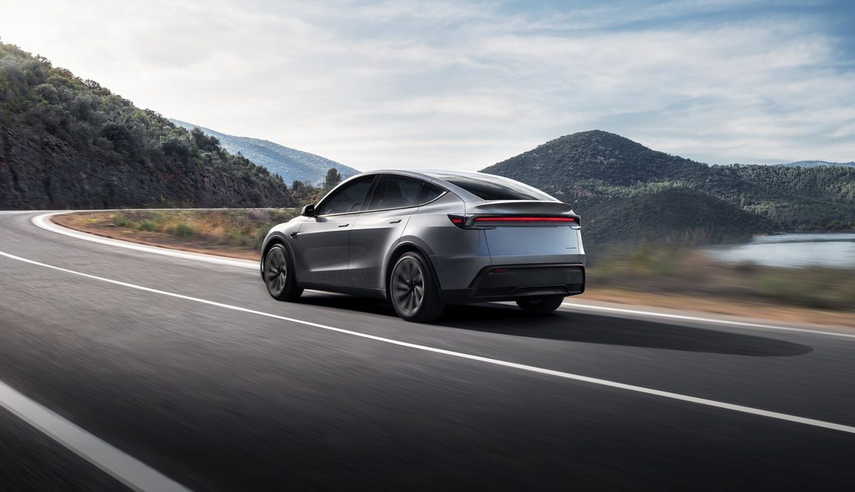 Grey Tesla Model Y on a mountain road